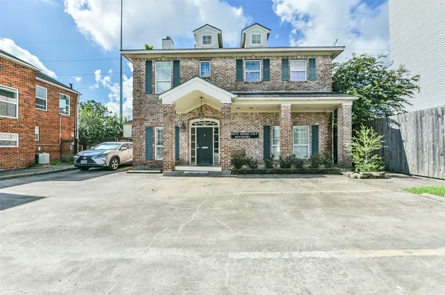 a view of a white house with a large windows