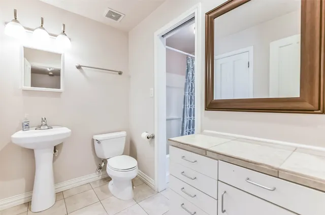 a bathroom with a sink a mirror and a shower