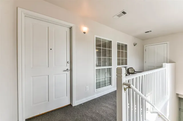 a view of livingroom with furniture and windows