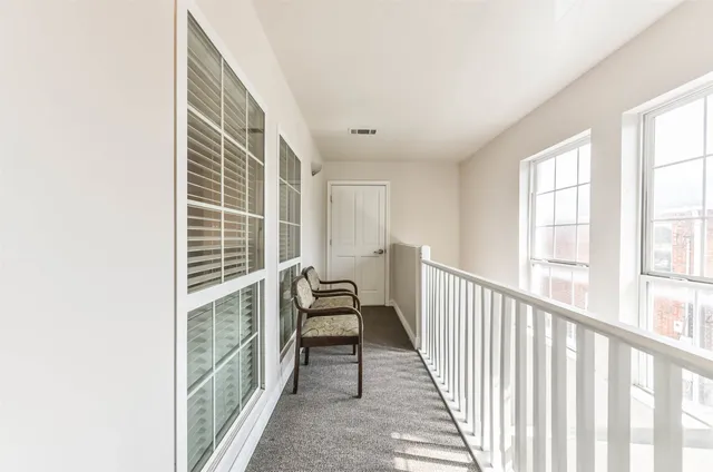 a view of a room with windows