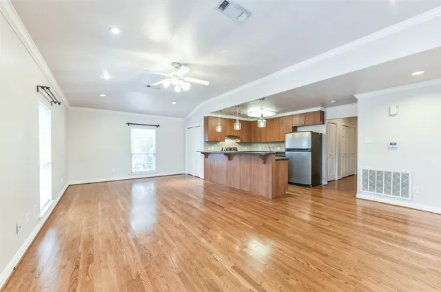 a view of kitchen with cabinets and wooden floor