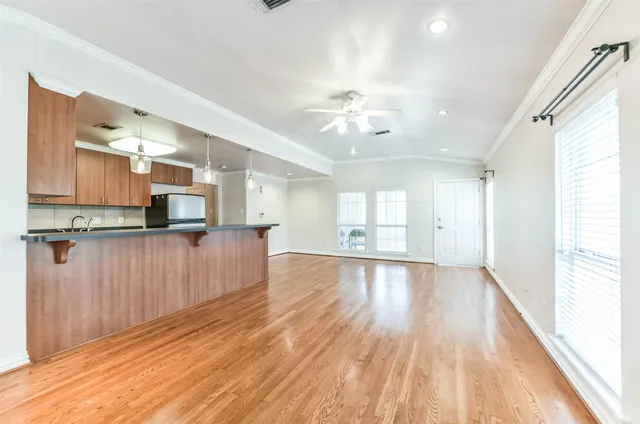 a view of a kitchen with a sink and a window