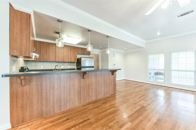 a view of kitchen with wooden floor