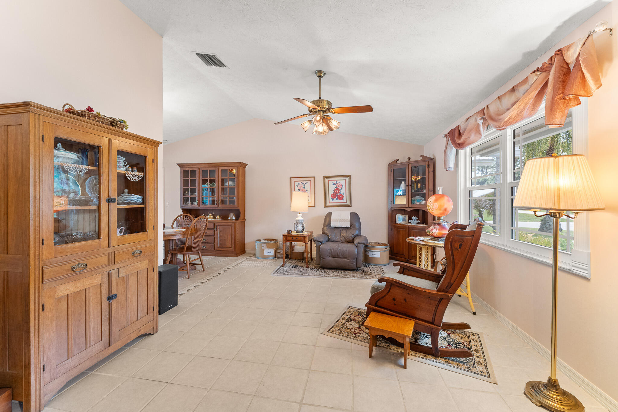 1653 Southwest 85th Terrace Stuart, FL 34997 - Photo 11 of 54 a living room with furniture and a chandelier
