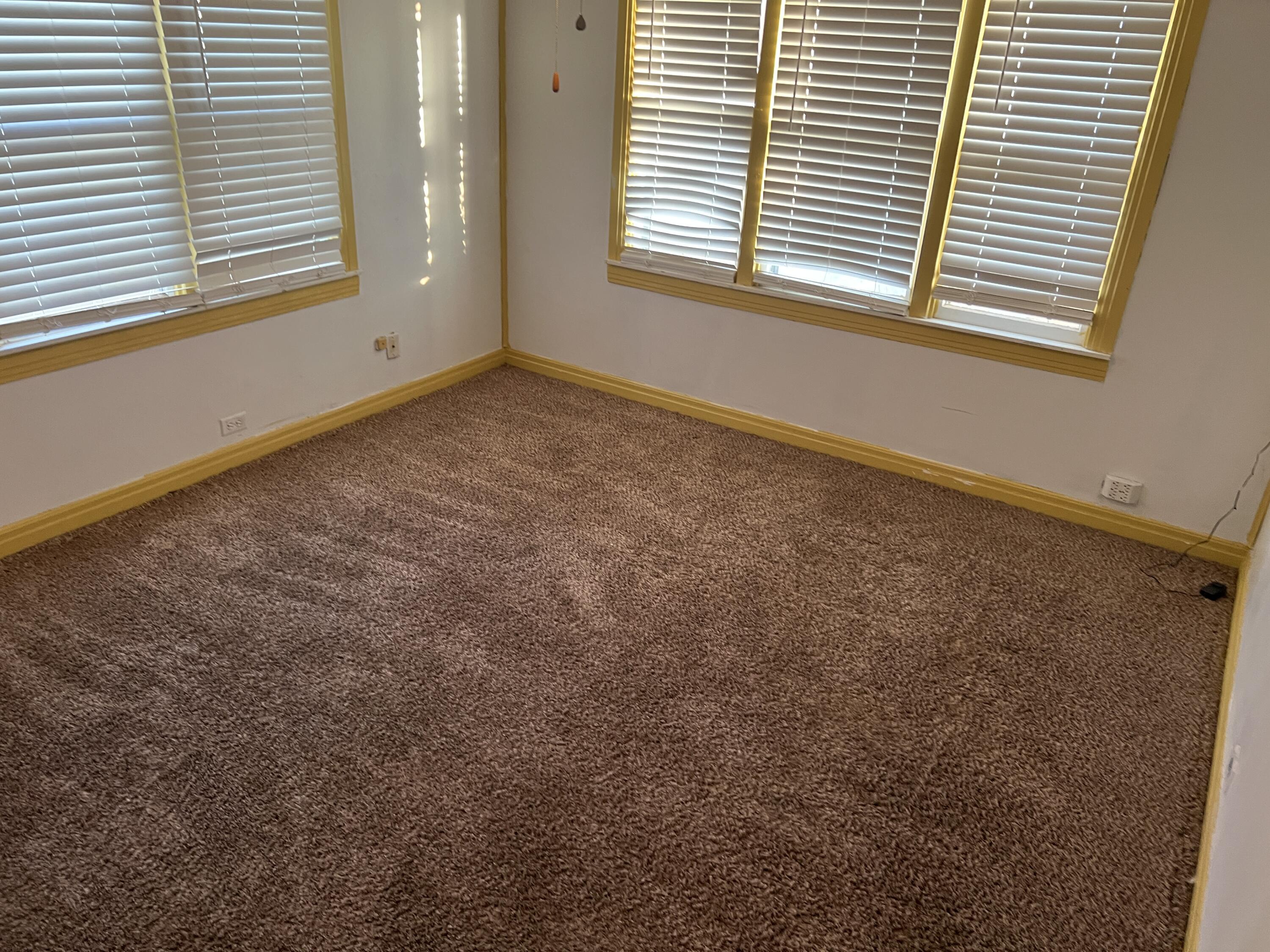 203 Northeast Alpine Plainview, TX 79072 - Photo 10 of 15 an empty room with a window