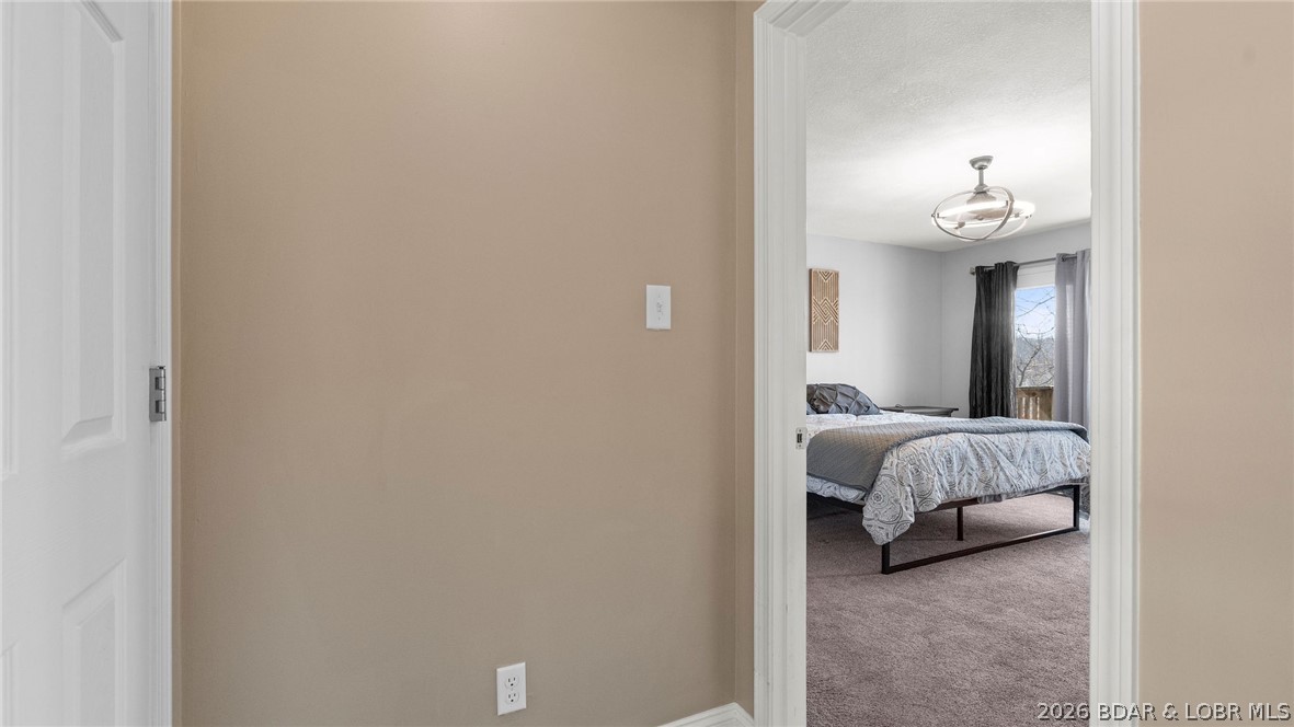 1500 Swiss Village Road Osage Beach, MO 65065 - Photo 28 of 83 2nd bedroom walk out deck