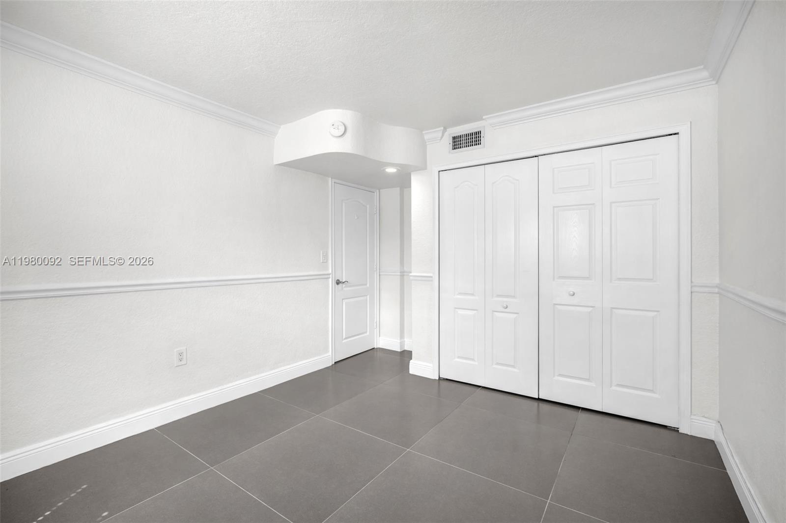 3245 Virginia Street, Unit 26 Miami, FL 33133 - Photo 12 of 26 a view of an empty room