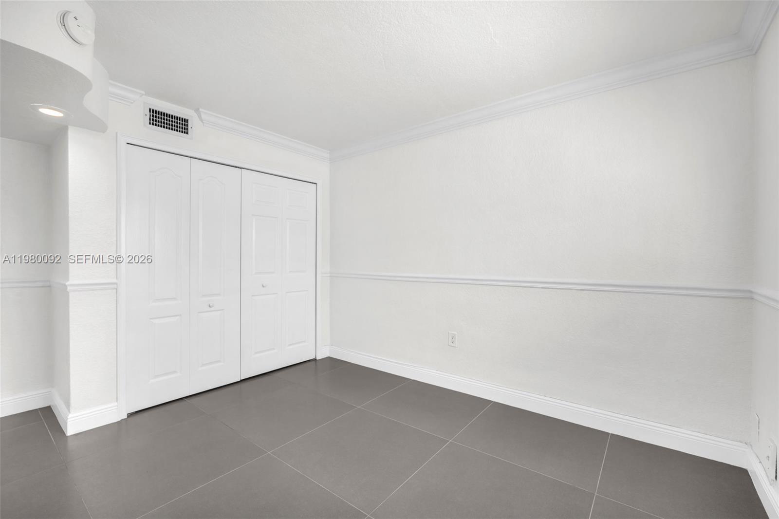 3245 Virginia Street, Unit 26 Miami, FL 33133 - Photo 13 of 26 a view of an empty room