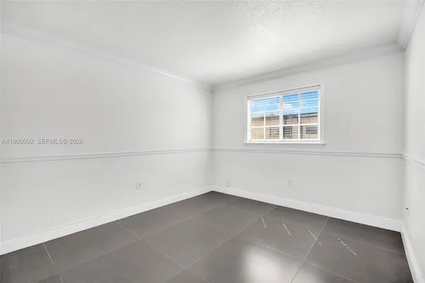an empty room with a empty space and window