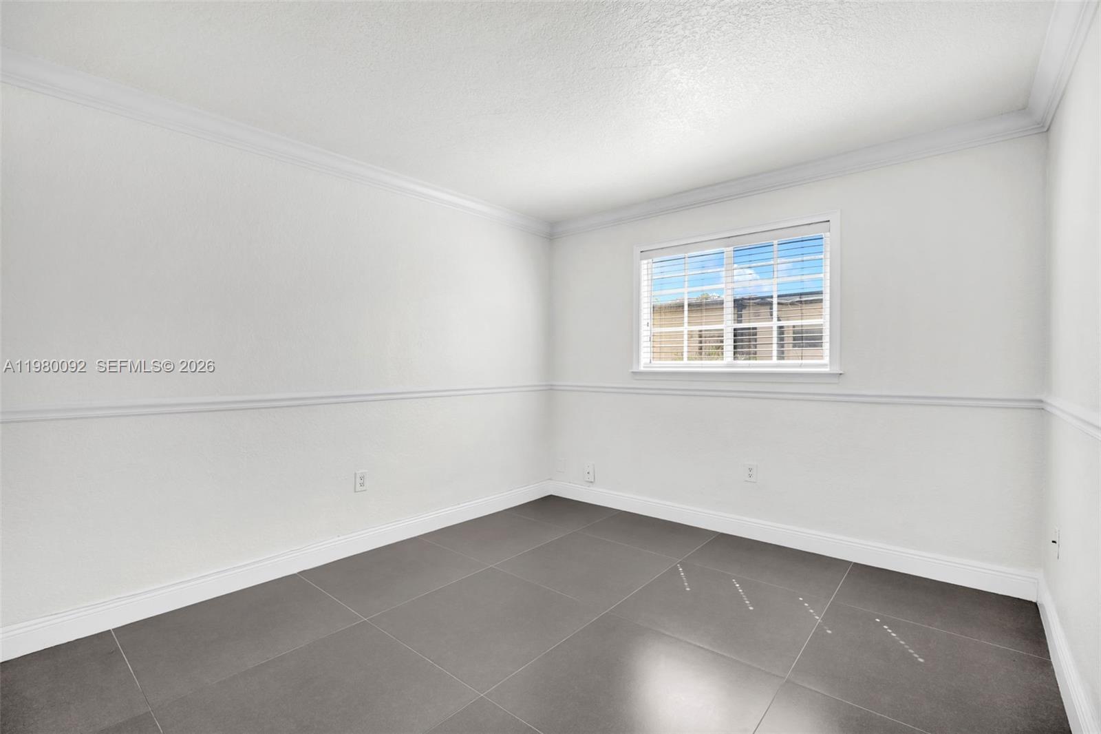 3245 Virginia Street, Unit 26 Miami, FL 33133 - Photo 14 of 26 an empty room with a empty space and window