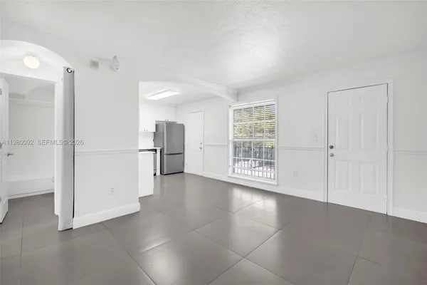 a view of an empty room with a window