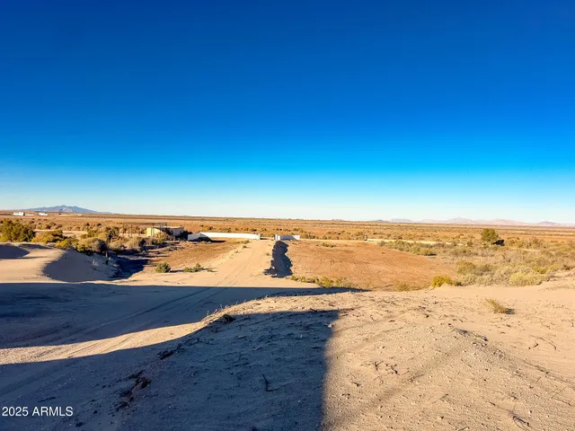 a view of a patio with table and chairs