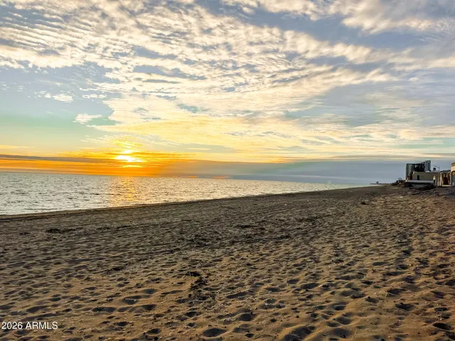 an aerial view of a backyard with table and chairs