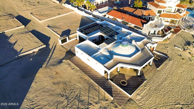 an aerial view of a house with a garden and balcony