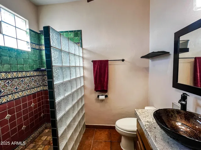 a bathroom with a toilet and a sink