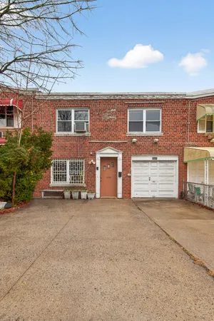a view of a house with a yard and garage