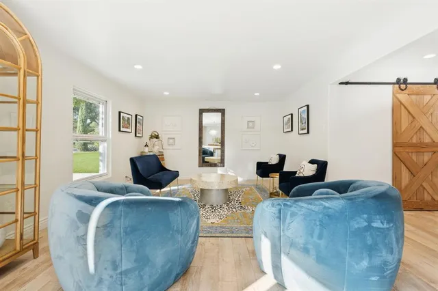 a living room with furniture and a lamp