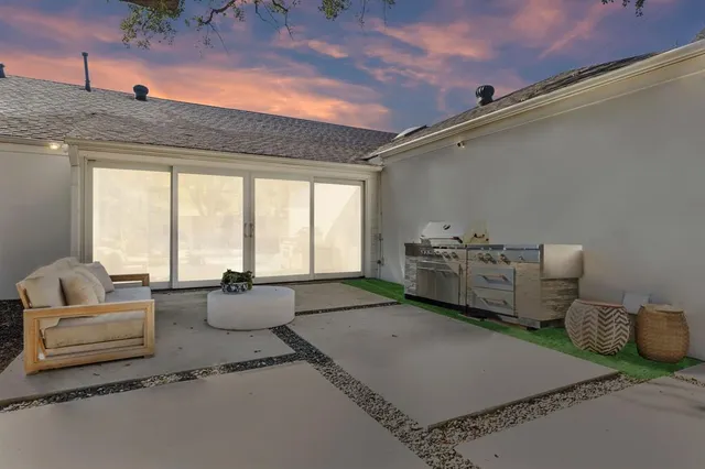 a living room with furniture and white walls