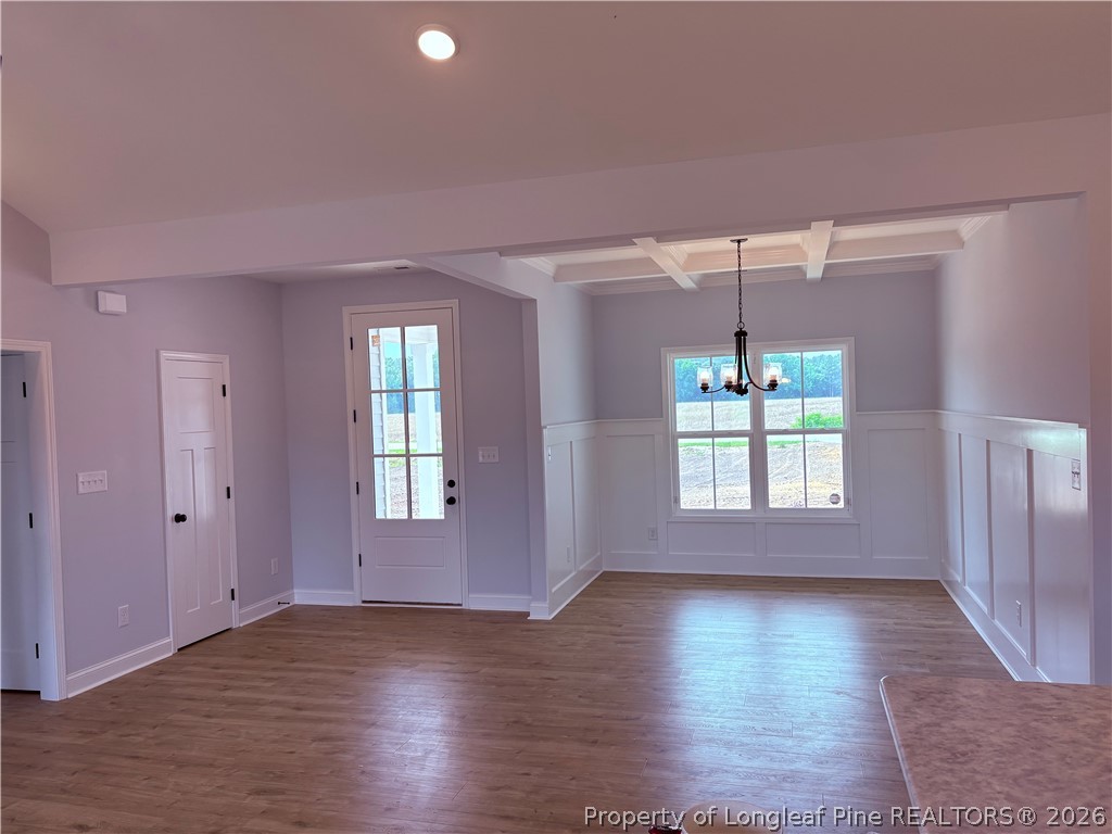 1075 Purdie-Hall Road Tar Heel, NC 28392 - Photo 3 of 28 a view of an empty room with wooden floor and a window