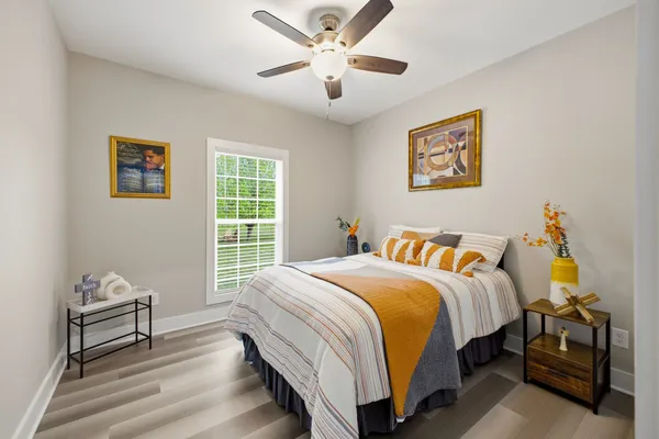 a bedroom with a bed and a desk