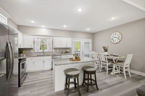 a kitchen with a sink stove and cabinets
