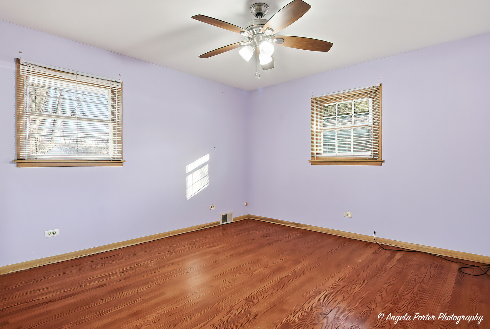 1913 Rancho Lane Des Plaines, IL 60016 - Photo 12 of 36 a view of an empty room with a window and wooden floor