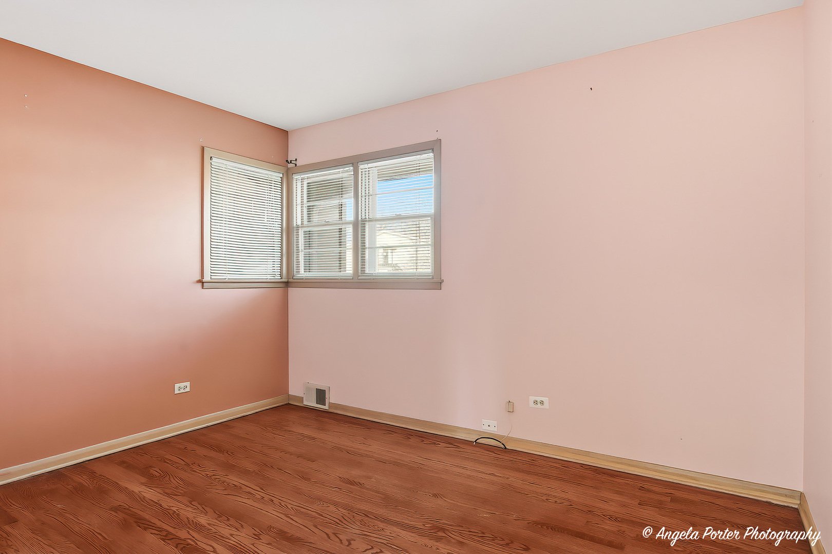 1913 Rancho Lane Des Plaines, IL 60016 - Photo 14 of 36 an empty room with wooden floor and windows