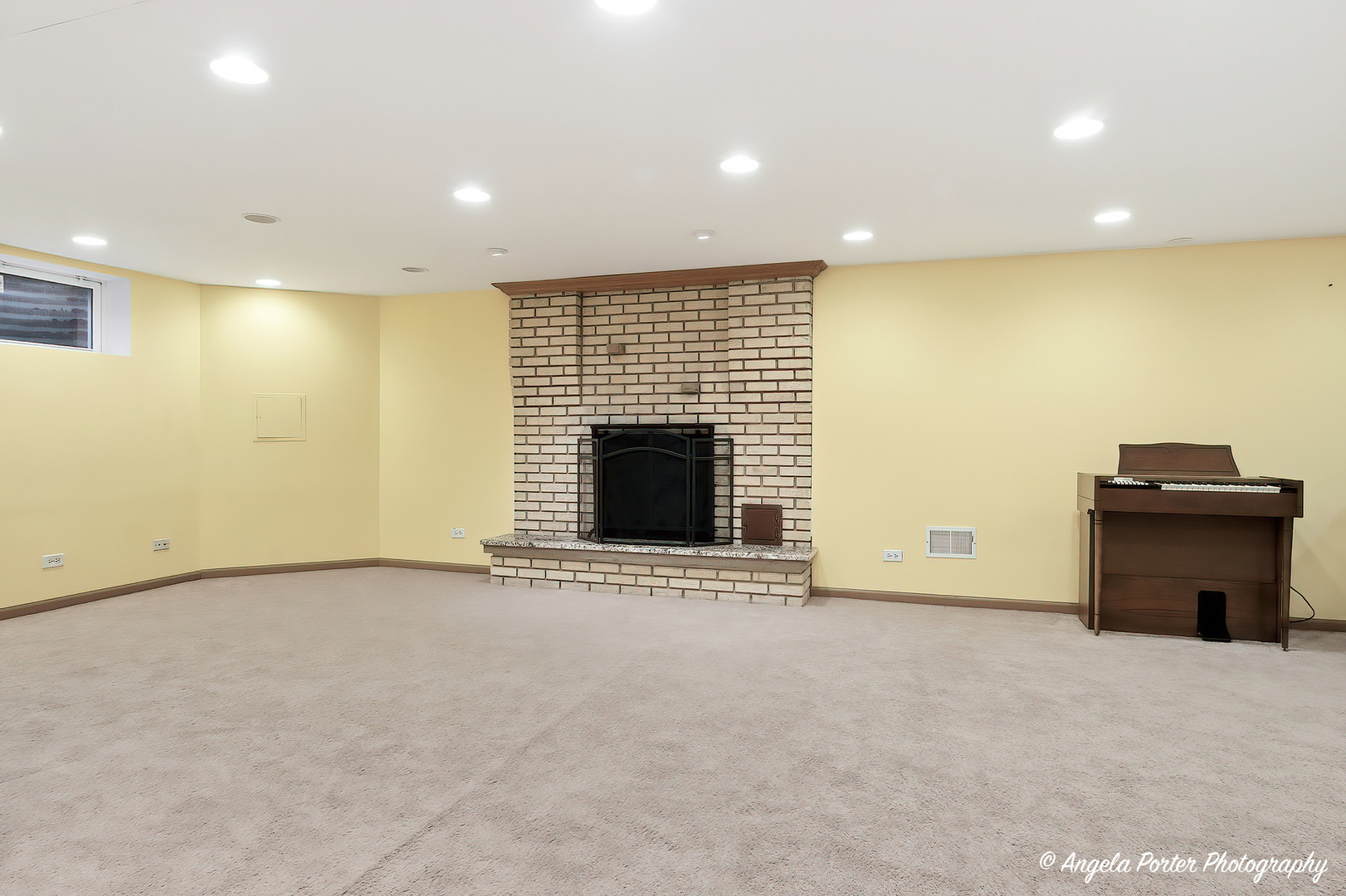 1913 Rancho Lane Des Plaines, IL 60016 - Photo 25 of 36 a view of an empty room with a fireplace and a window