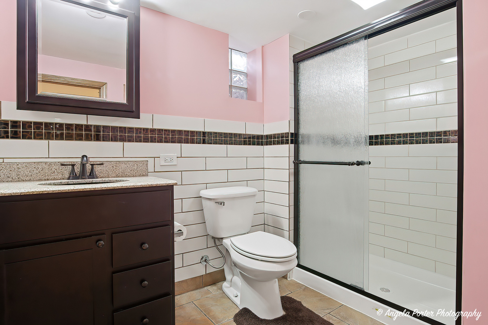1913 Rancho Lane Des Plaines, IL 60016 - Photo 29 of 36 a bathroom with a sink a toilet and shower