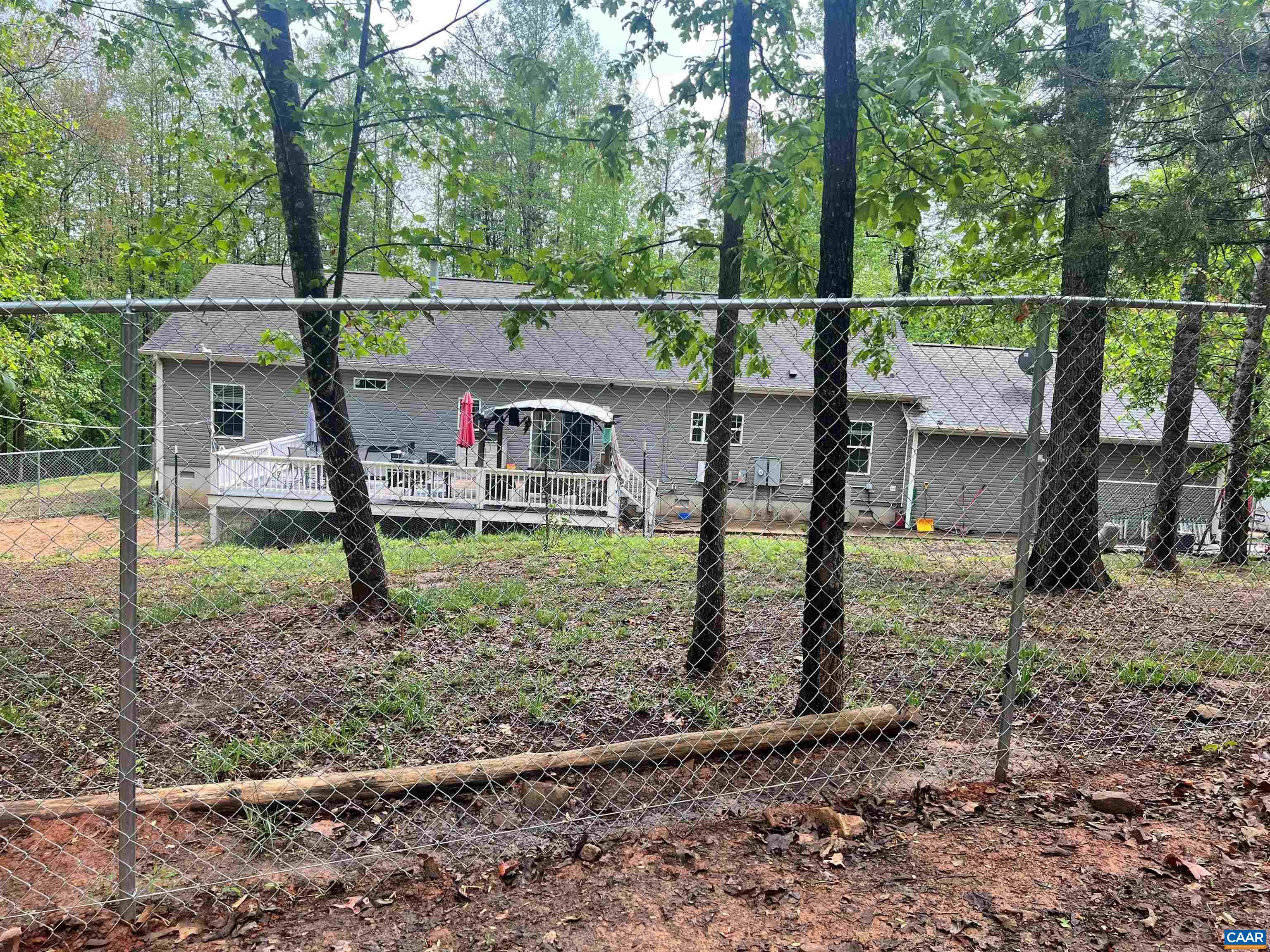2441 Tisdale Road Barboursville, VA 22923 - Photo 38 of 44 BEHIND is mini farm for horses boats dogs 4.92 acres oversized garage overf 2100 sq ft. on total 10 ACS