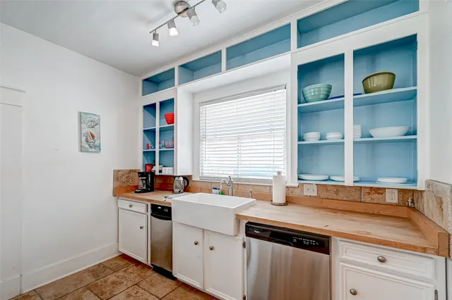 a bathroom with a sink a toilet and bathtub
