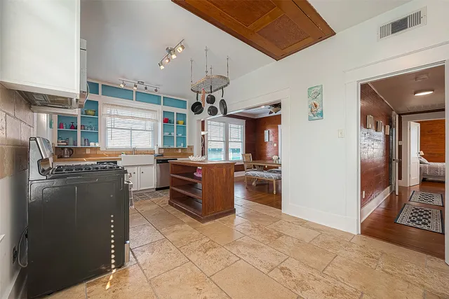 a bedroom with a bed couch and window