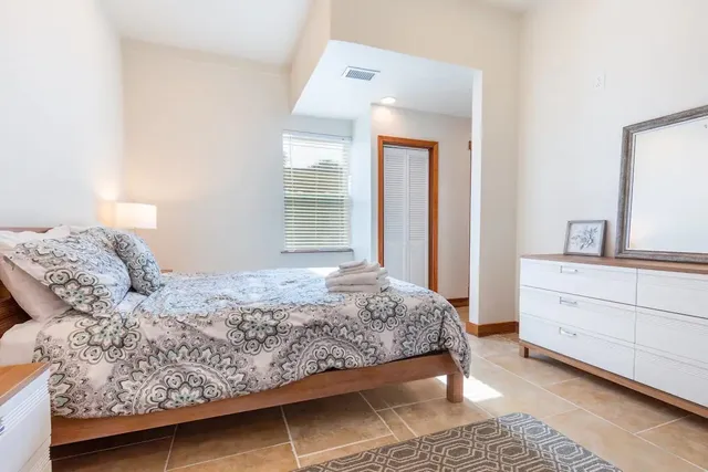 a kitchen with stainless steel appliances granite countertop a stove and a refrigerator