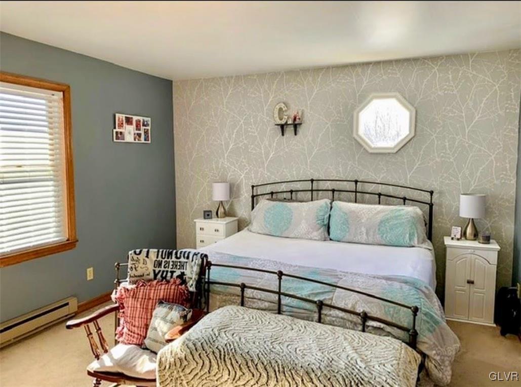 291 Sunset Road Milan, PA 18831 - Photo 32 of 38 a bedroom with a bed and dresser
