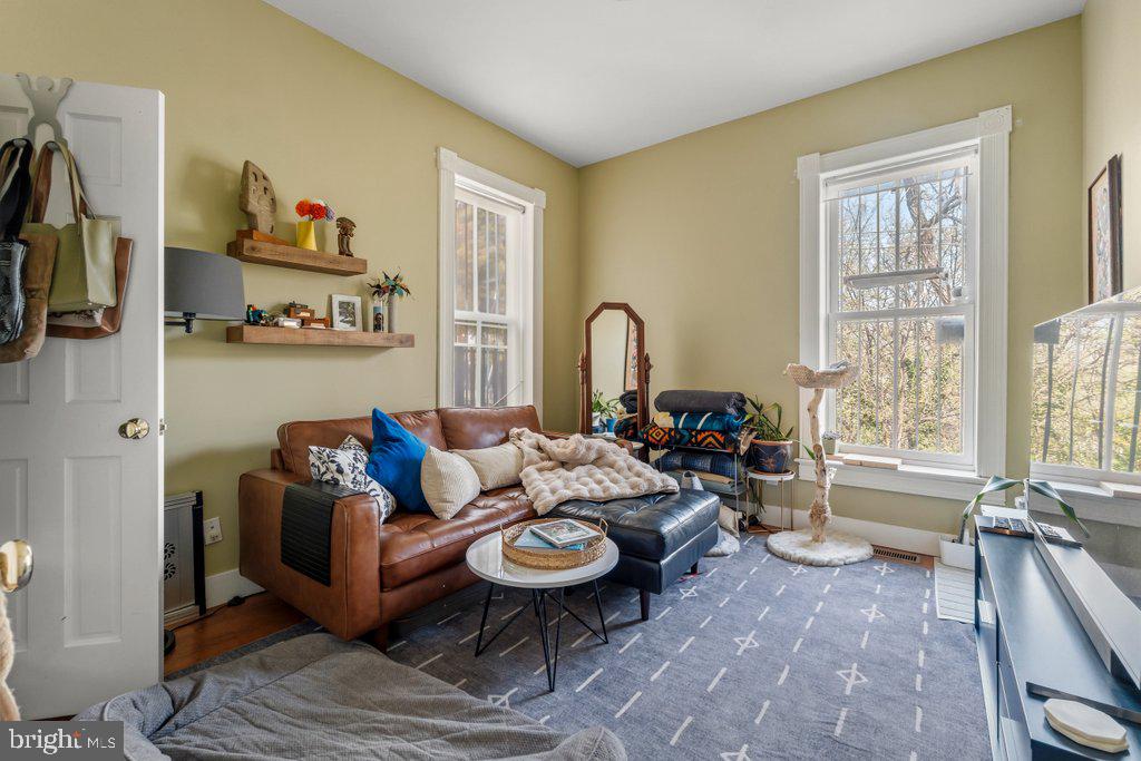 1215 John Street Baltimore, MD 21217 - Photo 21 of 34 a living room with furniture a rug and a large window