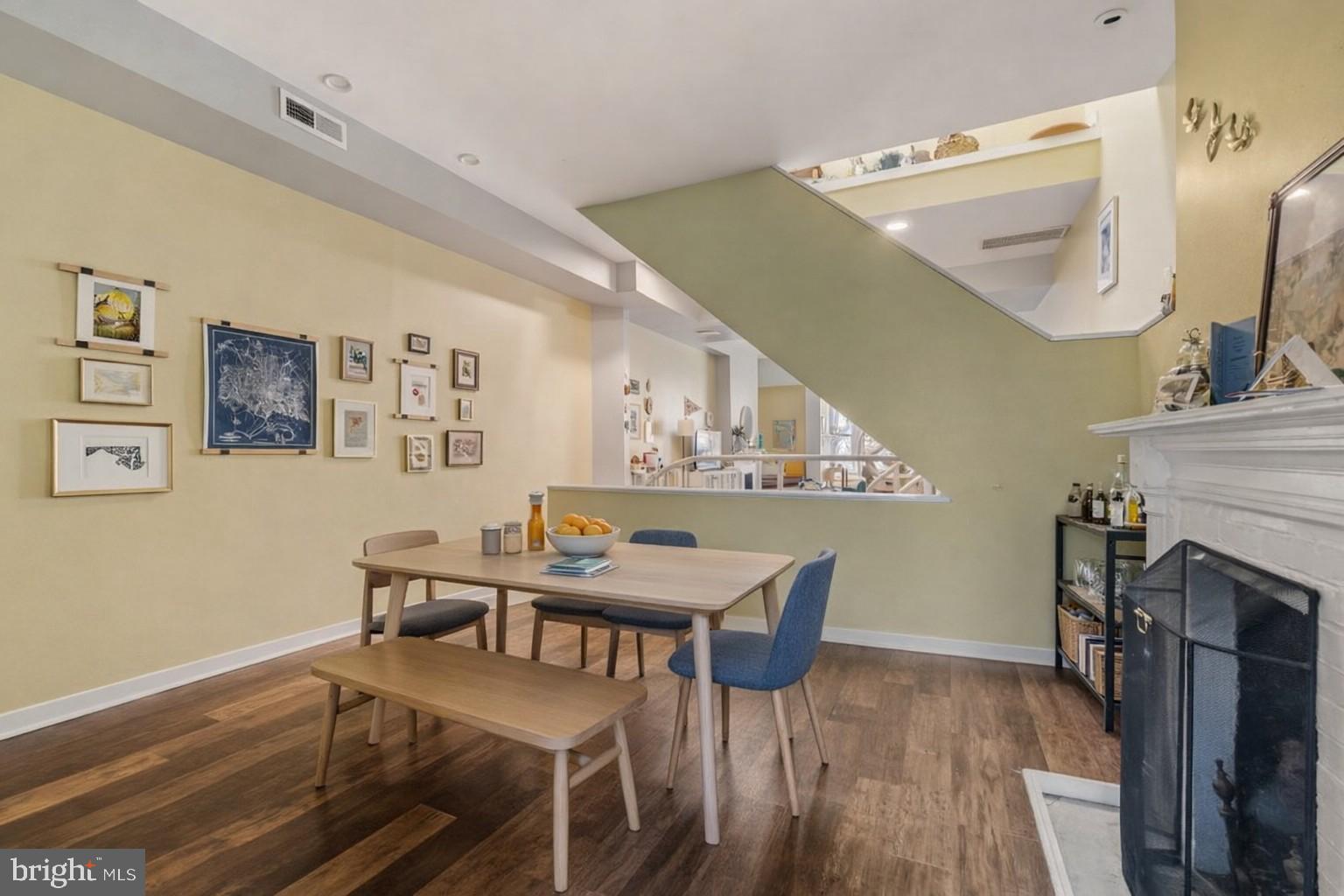 1215 John Street Baltimore, MD 21217 - Photo 6 of 34 a view of a dining room with furniture and wooden floor