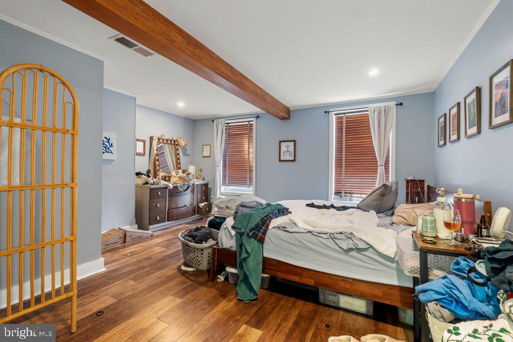 1215 John Street Baltimore, MD 21217 - Photo 9 of 34 a bed room with a bed and a window