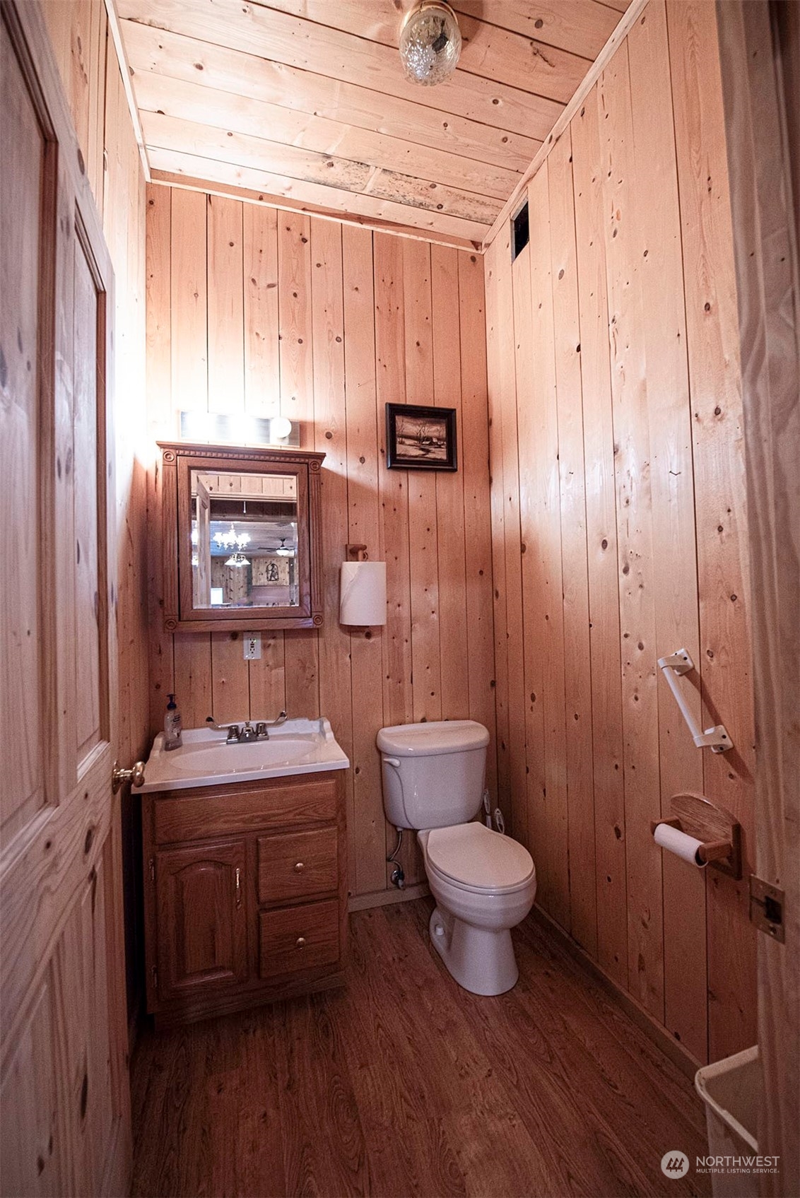 1666 Cummins Road Touchet, WA 99360 - Photo 27 of 35 a bathroom with a sink a toilet a mirror and shower curtain
