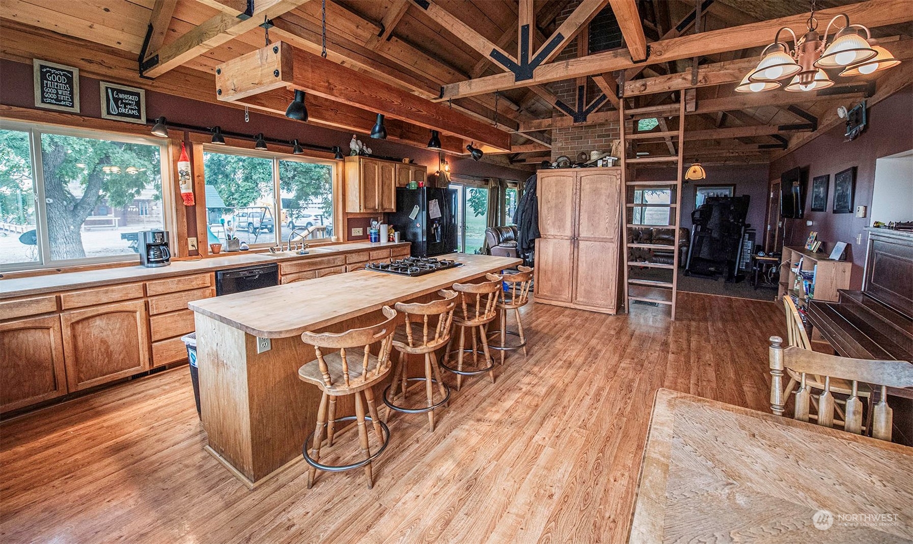 1666 Cummins Road Touchet, WA 99360 - Photo 8 of 35 a view of a kitchen with wooden floors and furniture