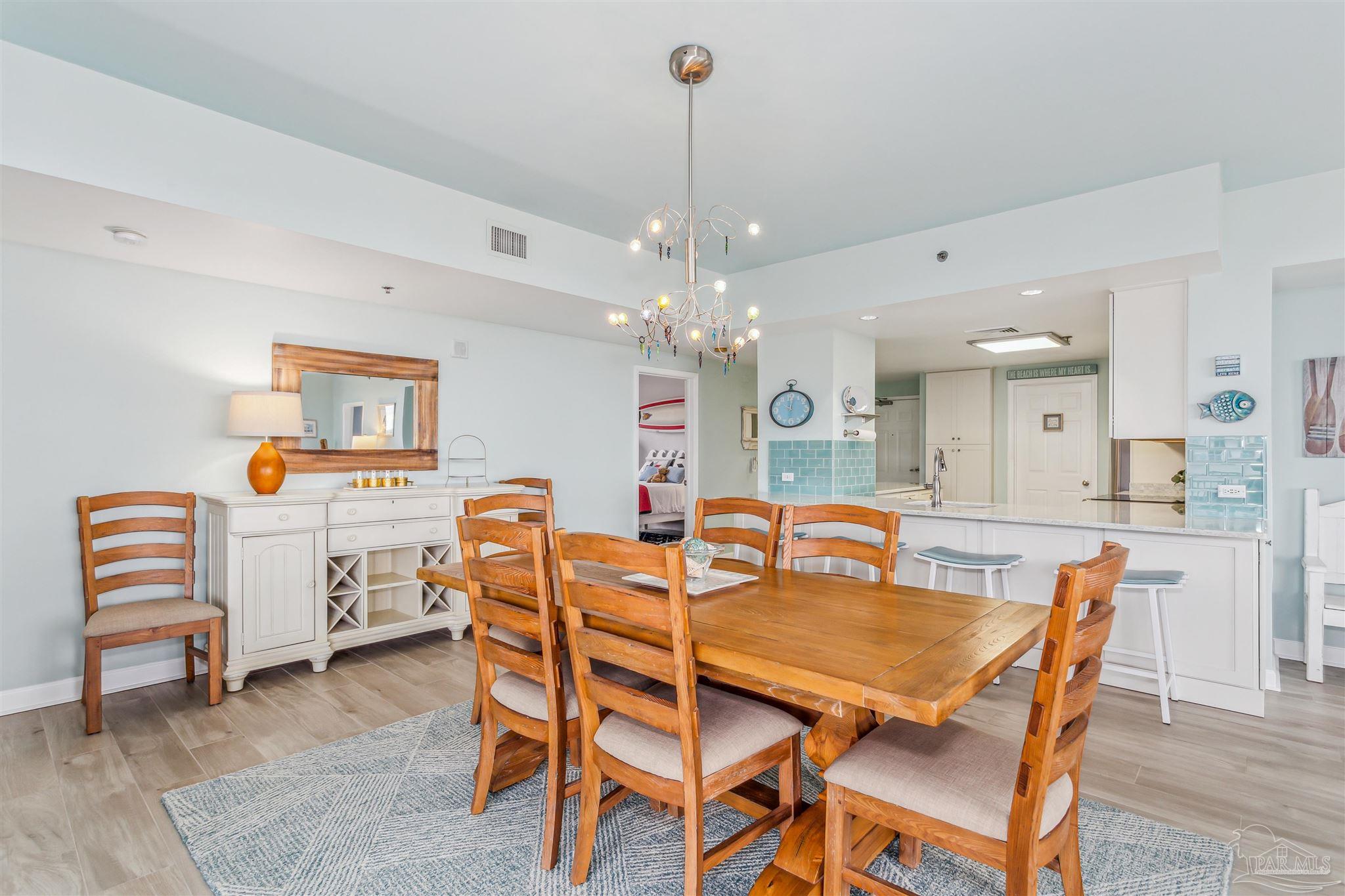 800 Fort Pickens Road, Unit 204 Pensacola Beach, FL 32561 - Photo 16 of 45 a dining room with furniture and window