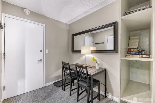 a kitchen with a table and chairs in it