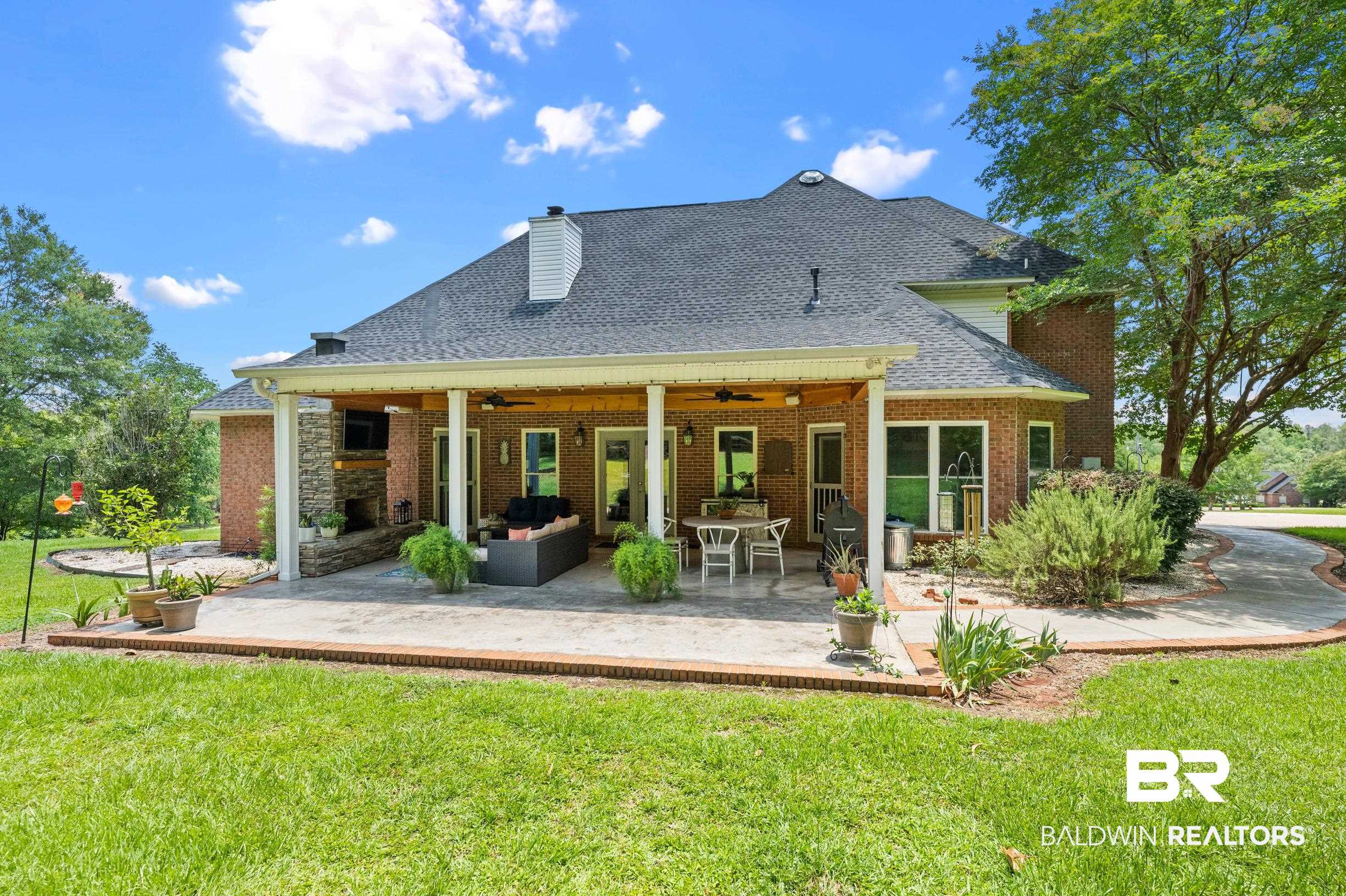 196 Morning Ridge Road Monroeville, AL 36460 - Photo 63 of 71 Back of house with a ceiling fan, a shingled roof, a lawn, outdoor lounge area, and a patio