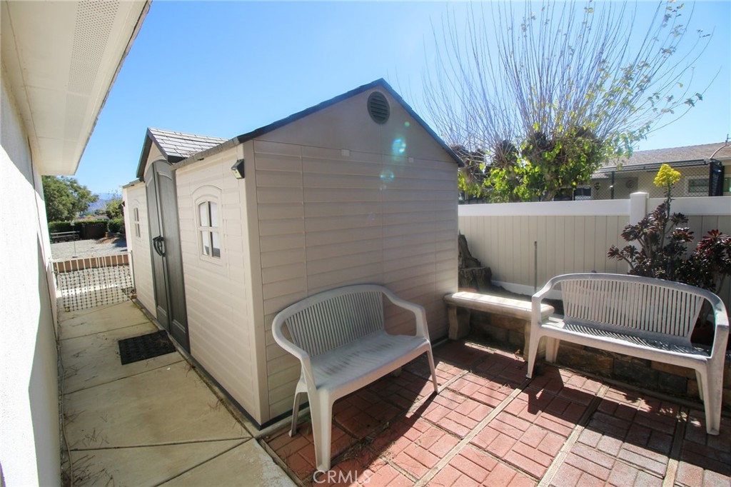25669 Warwick Road Menifee, CA 92586 - Photo 21 of 36 a balcony with furniture and a potted plant