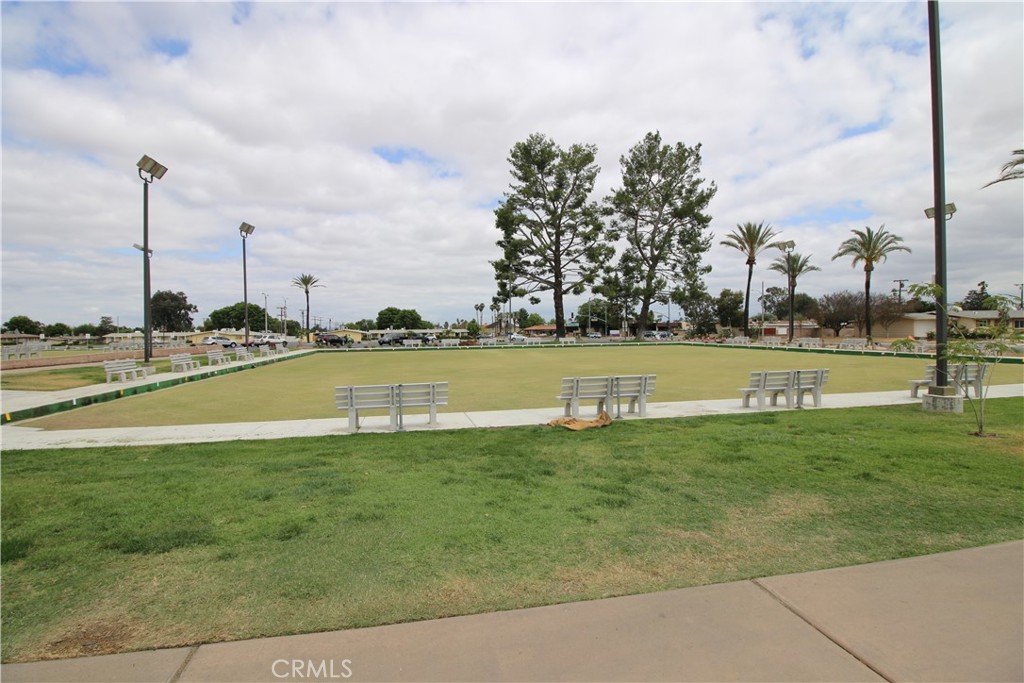 25669 Warwick Road Menifee, CA 92586 - Photo 29 of 36 a view of a lake with houses in the background