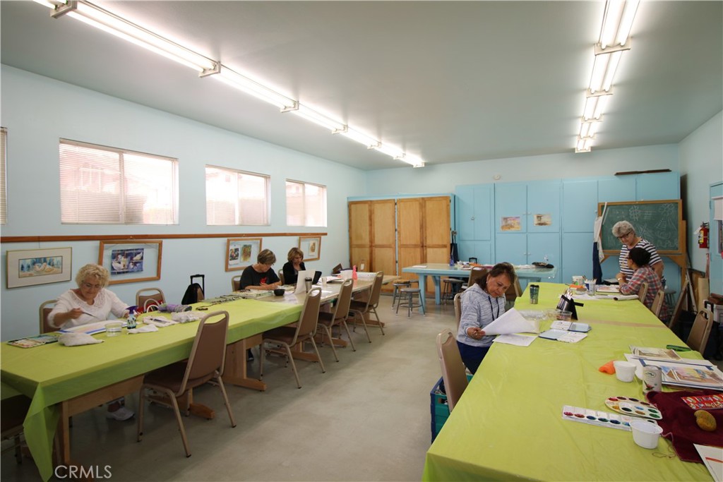 25669 Warwick Road Menifee, CA 92586 - Photo 33 of 36 a group of people sitting in a living room