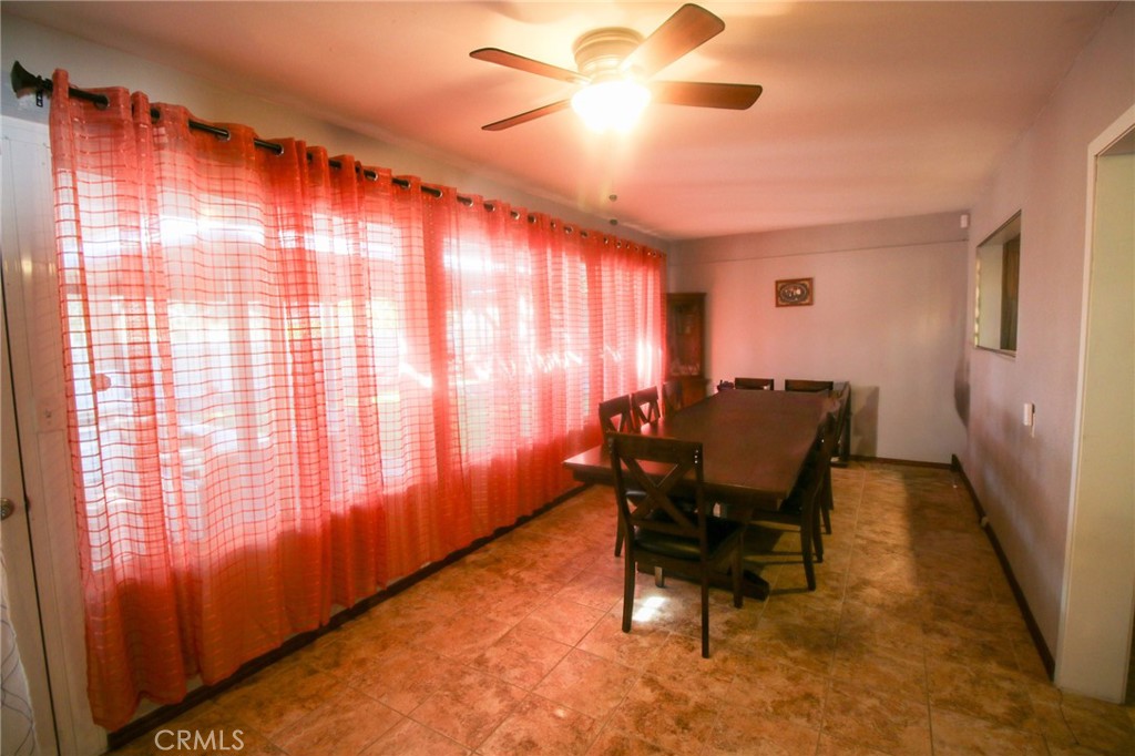 25669 Warwick Road Menifee, CA 92586 - Photo 9 of 36 a view of a workspace with furniture and a window