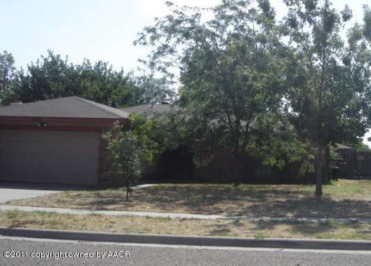 5321 Capulin Lane Amarillo, TX 79110 - Photo 1 of 14 a house with trees in the background
