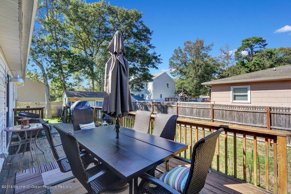 1520 Arient Road Forked River, NJ 08731 - Photo 37 of 39 a view of deck with furniture and trees