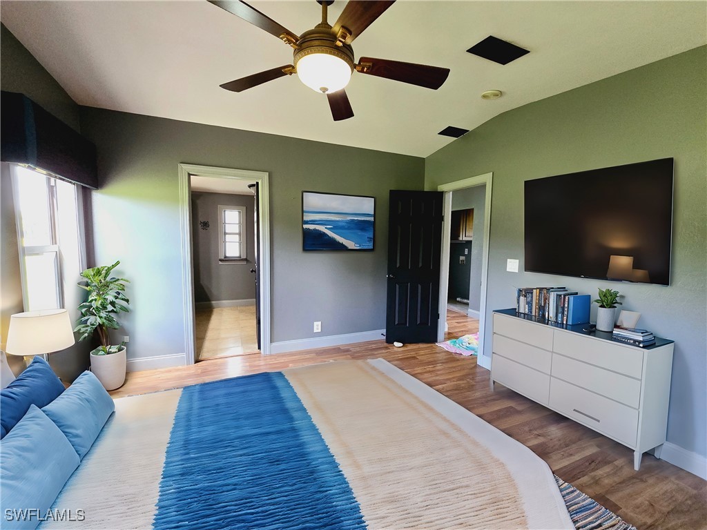 4650 County Road 78 LaBelle, FL 33935 - Photo 15 of 21 a bedroom with furniture and a flat screen tv