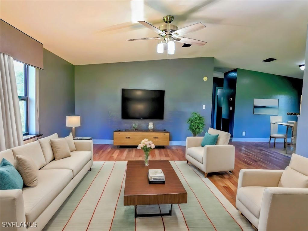 4650 County Road 78 LaBelle, FL 33935 - Photo 8 of 21 a living room with furniture and a flat screen tv